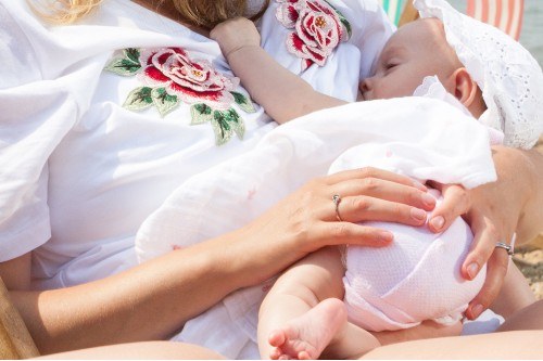 A baby being breastfed by her mum