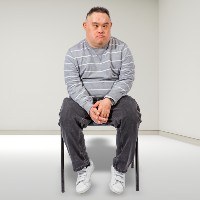 Man sitting alone in an empty room