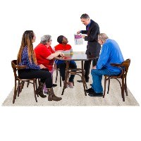 A group of people sitting around a table