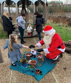 Small girl with Father Christmas