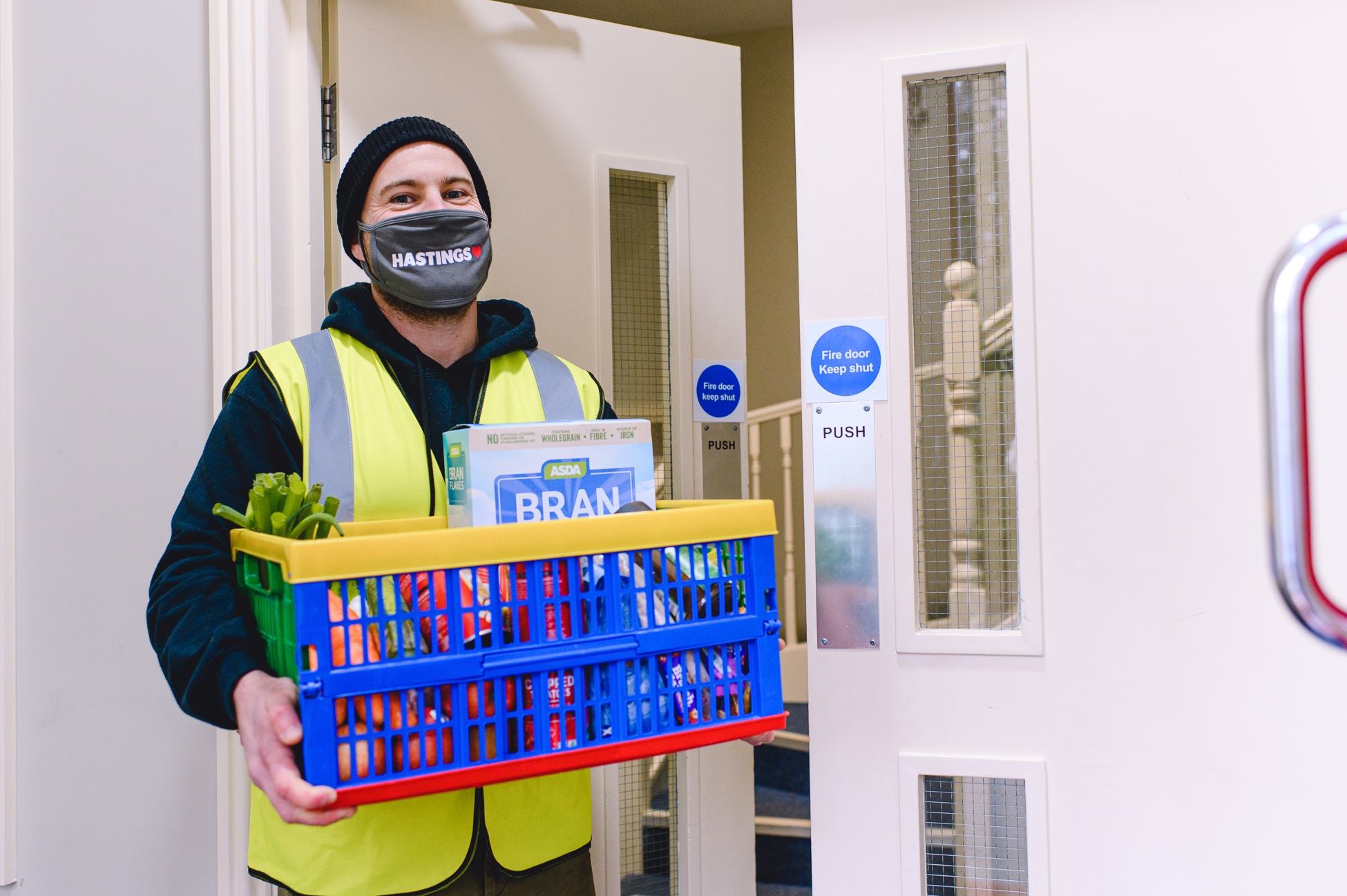 A Hastings HEART volunteer delivers a crate of food