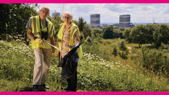 Two local residents, Margaret and David, clean litter at Hamiltonhill Claypits on a sunny day in Glasgow. 