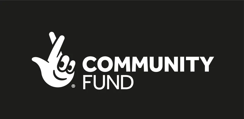 The National Lottery Community Fund white logo black background in English